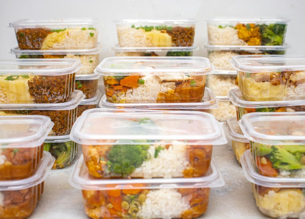 Multiple containers of prepared meals with rice and vegetables for easy meal management.